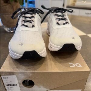 On Running White and Black Athletic Shoes